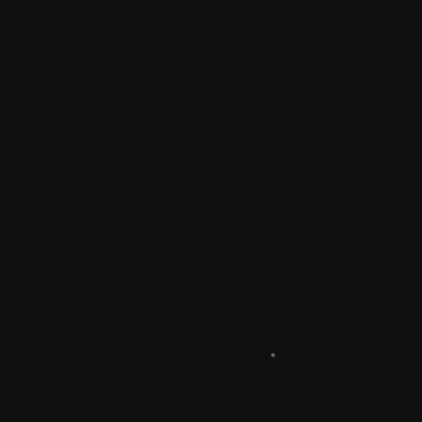 Ein überwiegend schwarzes Bild mit einem kleinen, schwachen Lichtpunkt in der rechten unteren Ecke, der sich von der Dunkelheit abhebt.